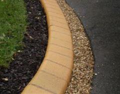 A Close Up of a Eurobrick Golden Sandstone Edge with Brown Mulch and 6mm Golden Gravel