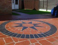 A Triple Quality Job of Eurobrick edging, Artificial Grass and Stencil concrete well Done