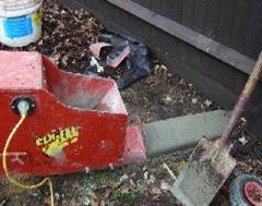 The Kwik Kerb machine at the start of a wood effect Eurostyle edging