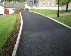 Commercial Kerbing with Drop Kerb on a Tarmac Drive